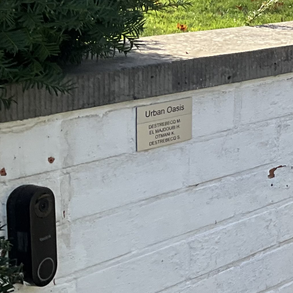 Urban Oasis entry sign at the property entrance in Maaseik